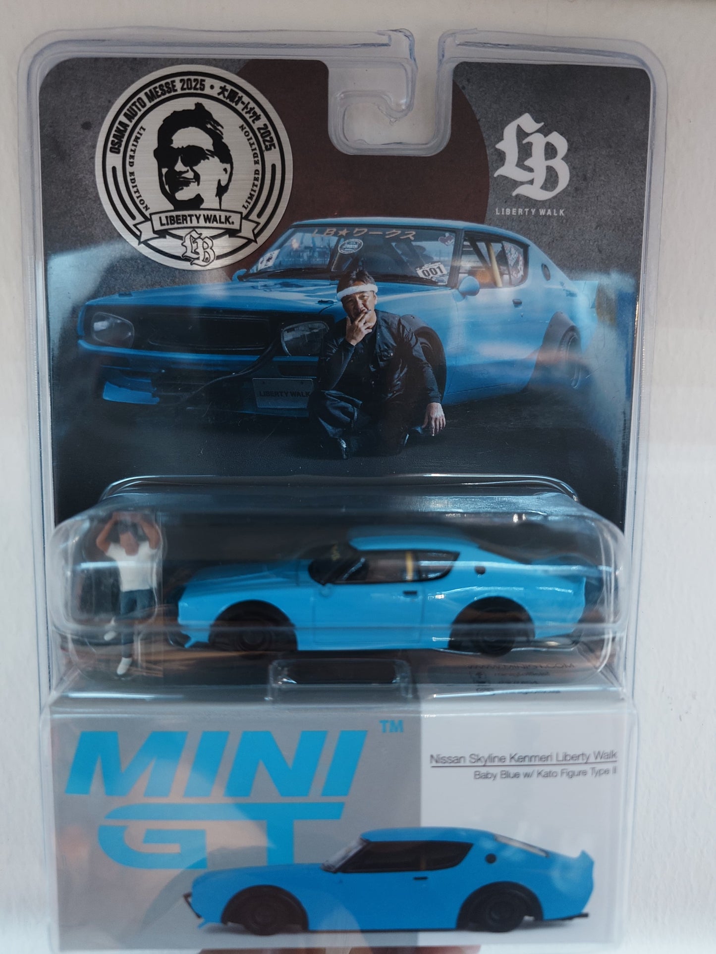 1/64 MiniGT Nissan Skyline Kenmeri Liberty Walk Baby Blue w/ Kato Figure Type II (MGT00711) (Osaka Auto Messe 2025 Exclusive)